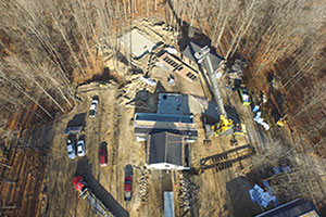 Aerial shot of an Oasis Homes Modular Project in woods